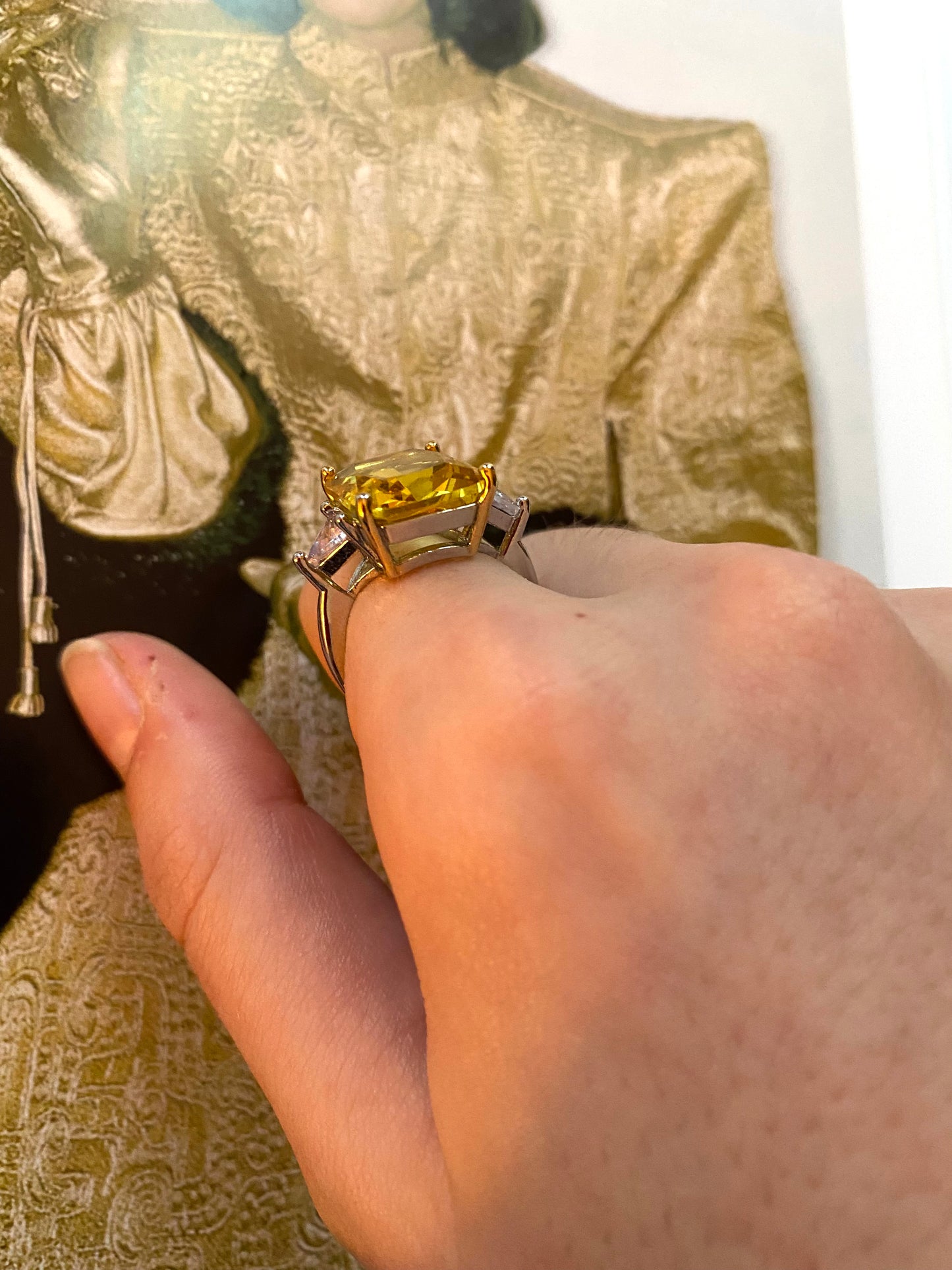 Yellow emerald shape solitaire ring