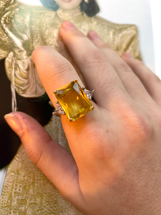 Yellow emerald shape solitaire ring
